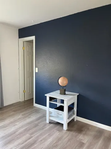 a view of livingroom with furniture and wooden floor