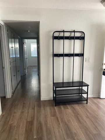 a view of entryway with wooden floor