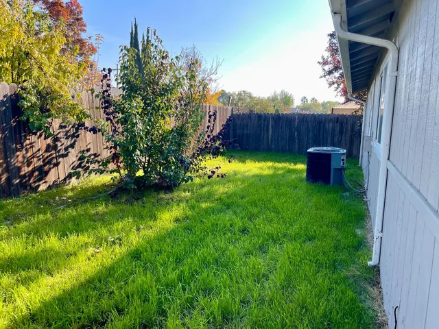 a backyard of a house with lots of green space