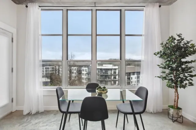 a view of a dining room with furniture window and outside view