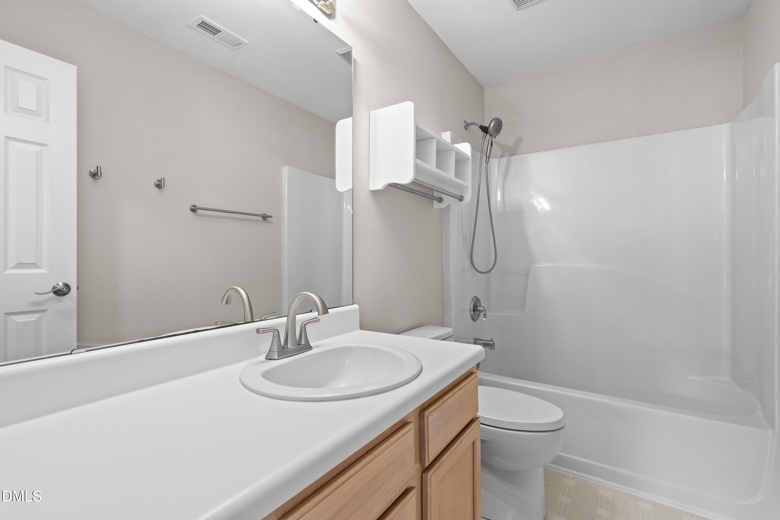3015 Rennit Court Raleigh, NC 27603 - Photo 31 of 40 a bathroom with a sink toilet and shower