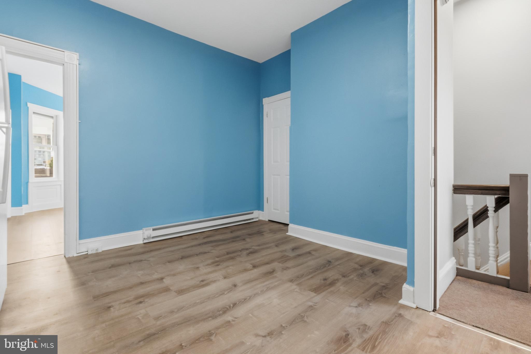 3545 North 11th Street, Unit 3 Philadelphia, PA 19140 - Photo 3 of 11 an empty room with wooden floor