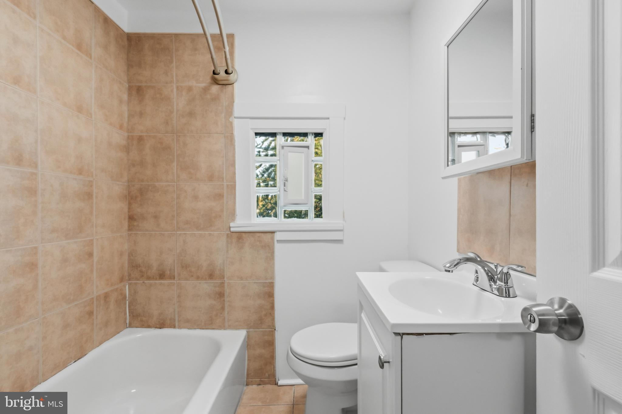 3545 North 11th Street, Unit 3 Philadelphia, PA 19140 - Photo 7 of 11 a bathroom with a sink toilet and shower