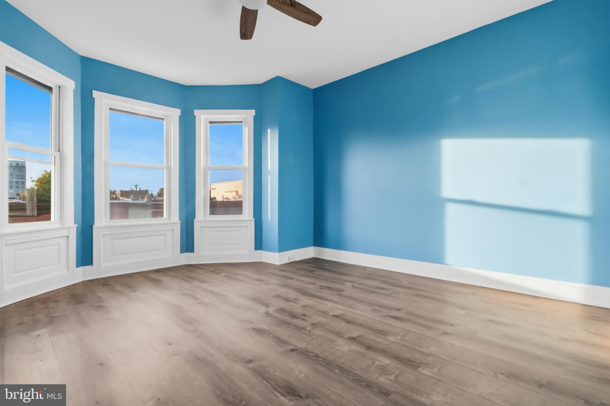3545 North 11th Street, Unit 3 Philadelphia, PA 19140 - Photo 8 of 11 an empty room with windows