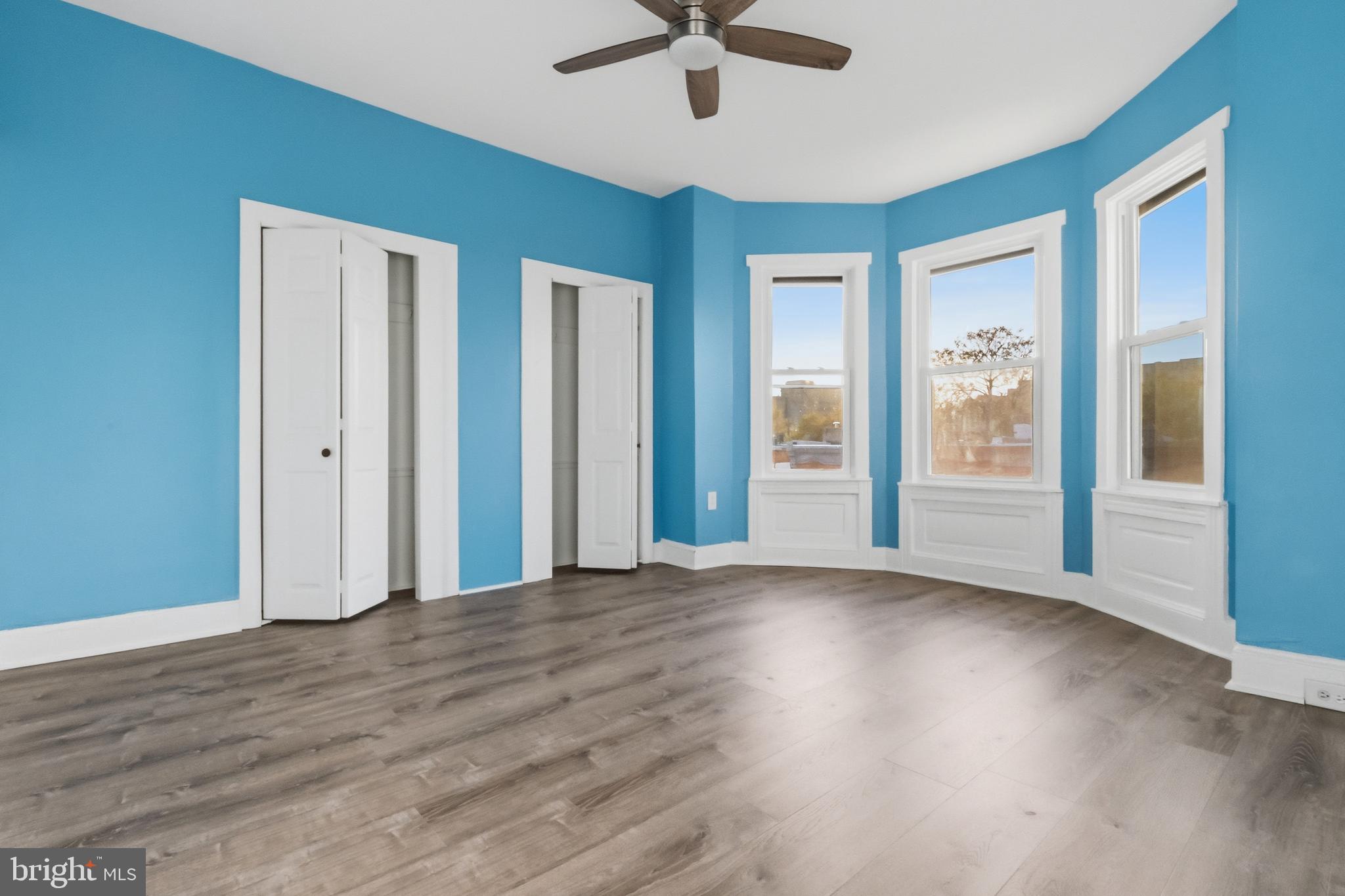 3545 North 11th Street, Unit 3 Philadelphia, PA 19140 - Photo 9 of 11 wooden floor in an empty room with a window