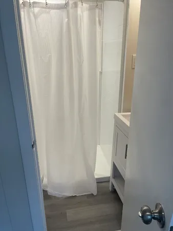 a bathroom with a sink sitting under a vanity