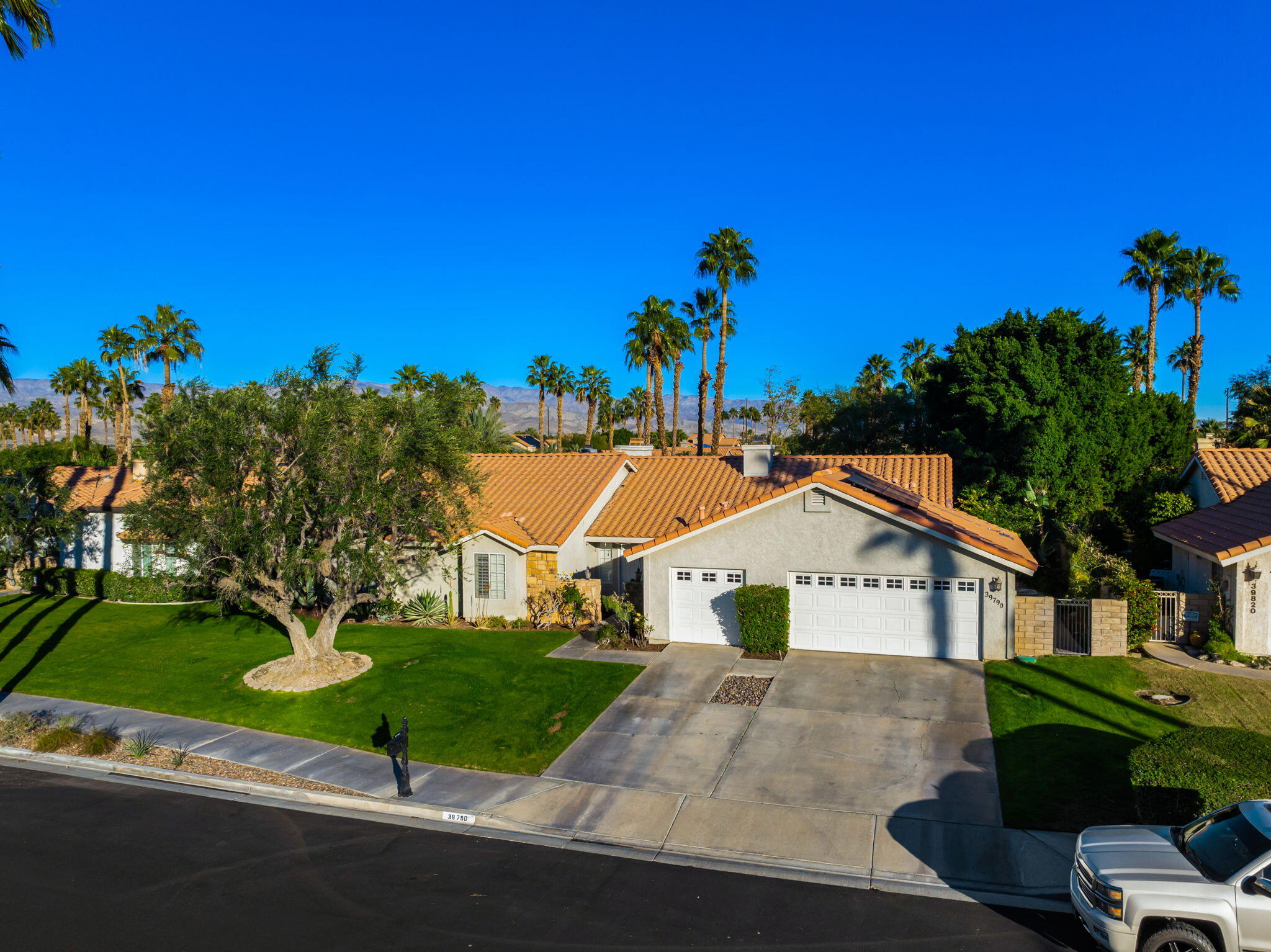 39790 Regency Way Palm Desert, CA 92211 - Photo 15 of 59 a view of house with a yard and potted plants