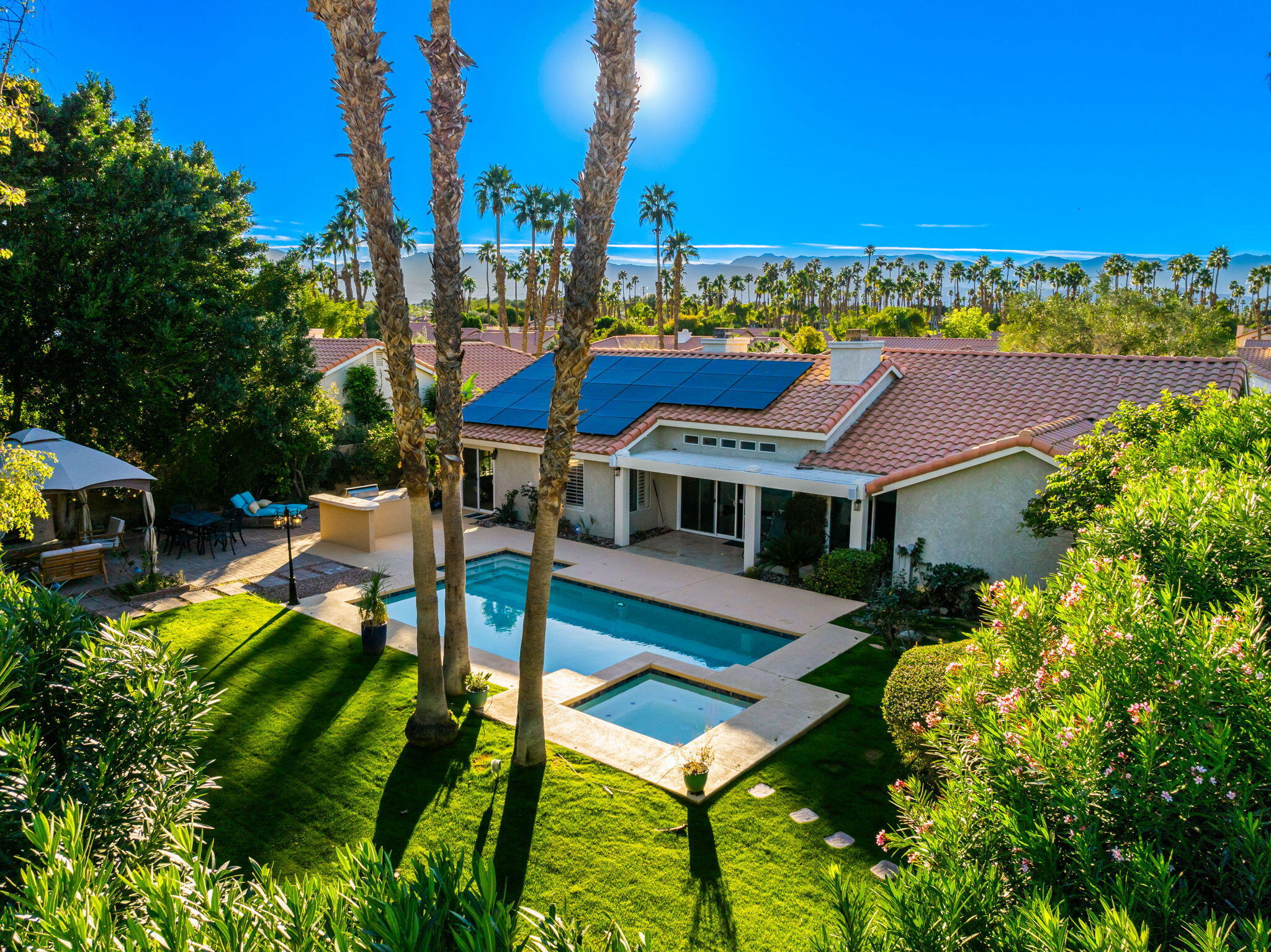 39790 Regency Way Palm Desert, CA 92211 - Photo 19 of 59 a view of a house with pool and chairs