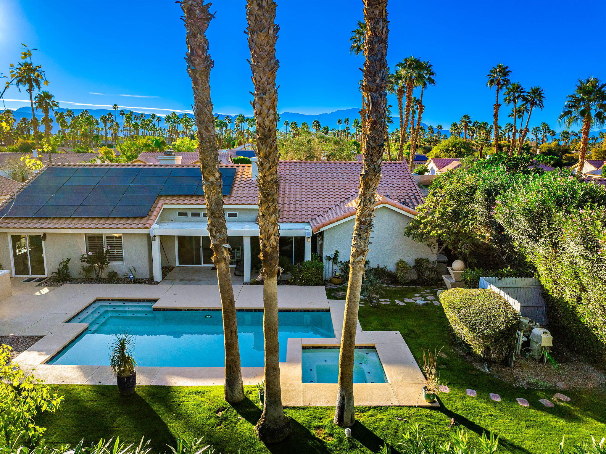 39790 Regency Way Palm Desert, CA 92211 - Photo 20 of 59 a front view of a house with a yard