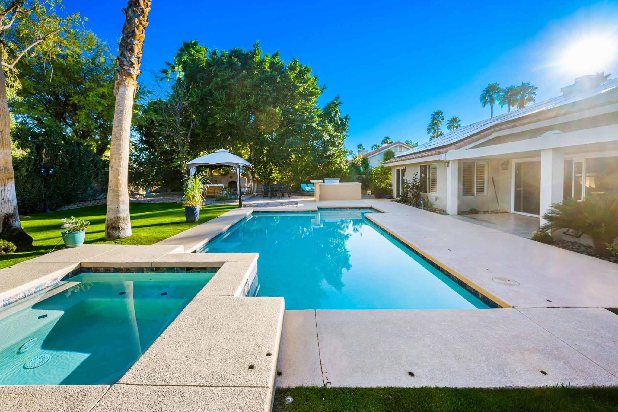 39790 Regency Way Palm Desert, CA 92211 - Photo 30 of 59 a view of outdoor space yard swimming pool and porch