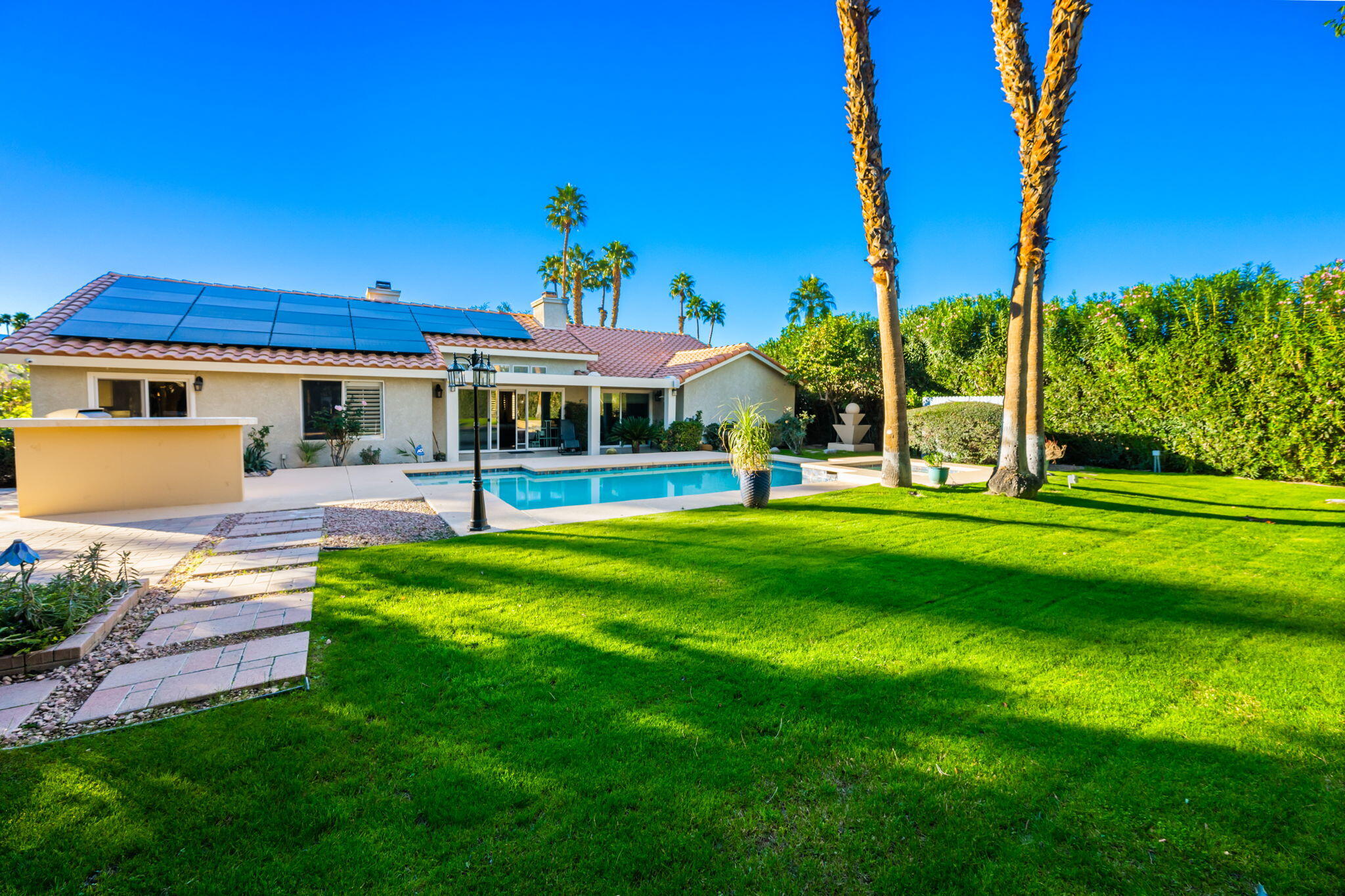 39790 Regency Way Palm Desert, CA 92211 - Photo 33 of 59 a view of a house with a yard