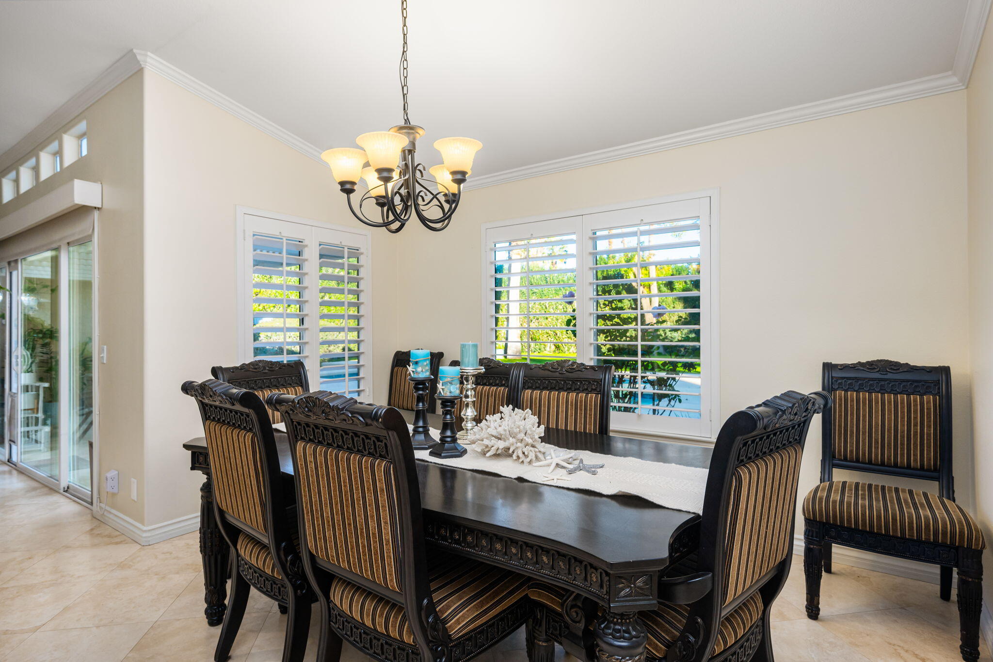 39790 Regency Way Palm Desert, CA 92211 - Photo 46 of 59 a view of a dining room with furniture window and outside view