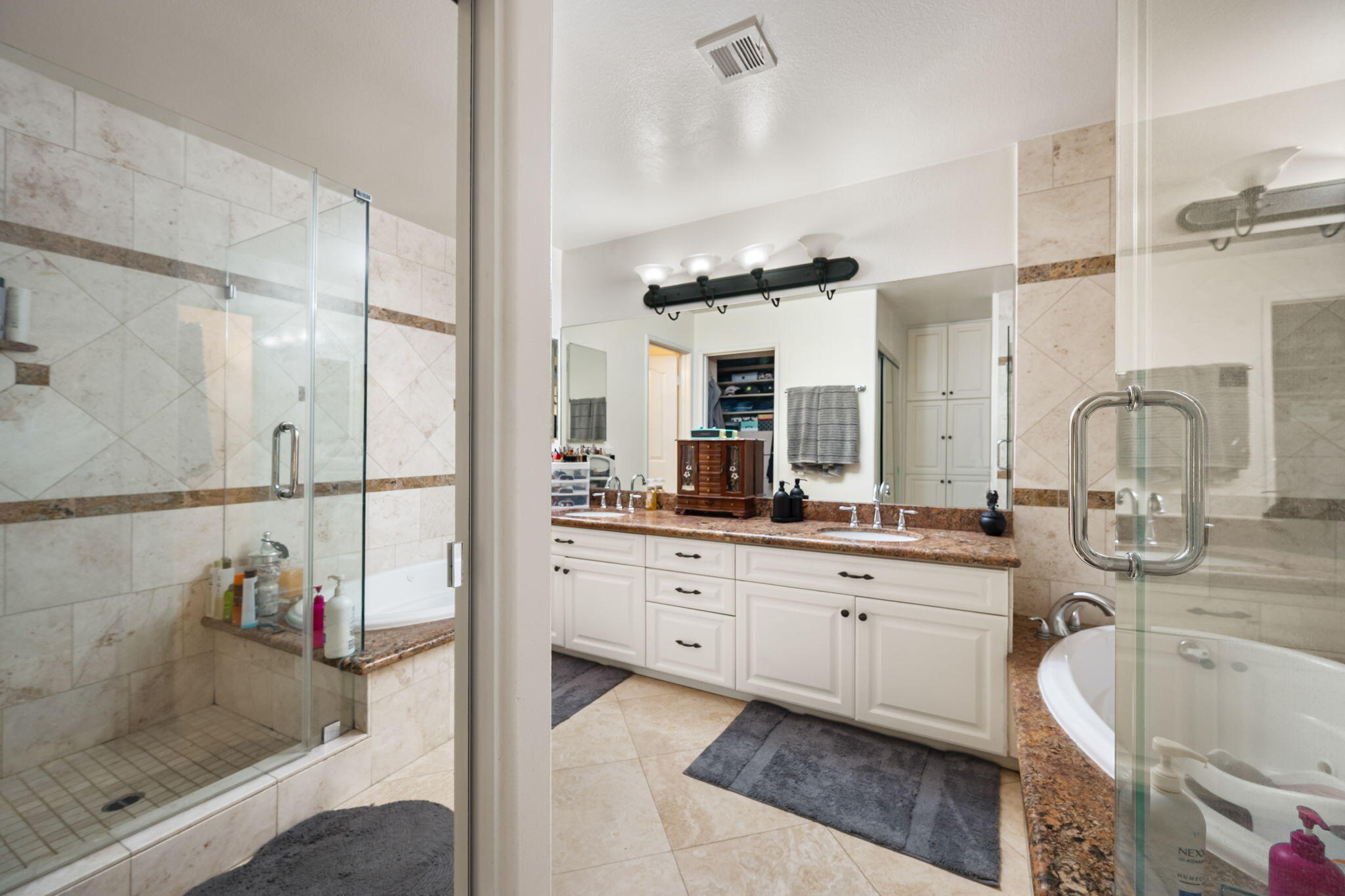 39790 Regency Way Palm Desert, CA 92211 - Photo 55 of 59 a spacious bathroom with a sink mirror and shower