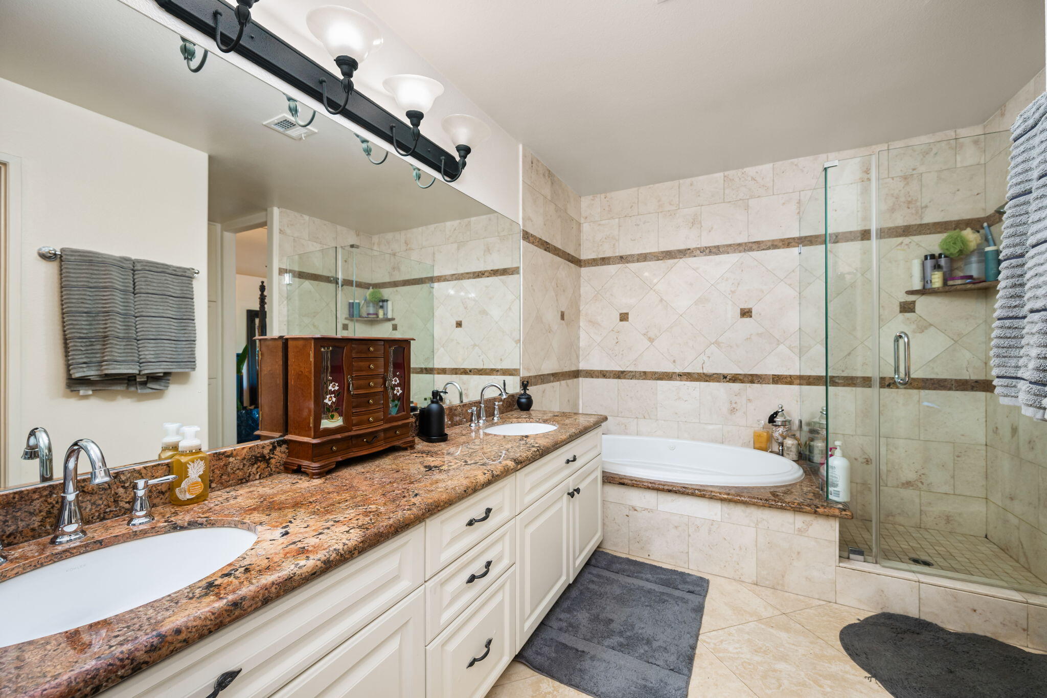 39790 Regency Way Palm Desert, CA 92211 - Photo 56 of 59 a bathroom with a granite countertop double vanity sink a mirror and shower