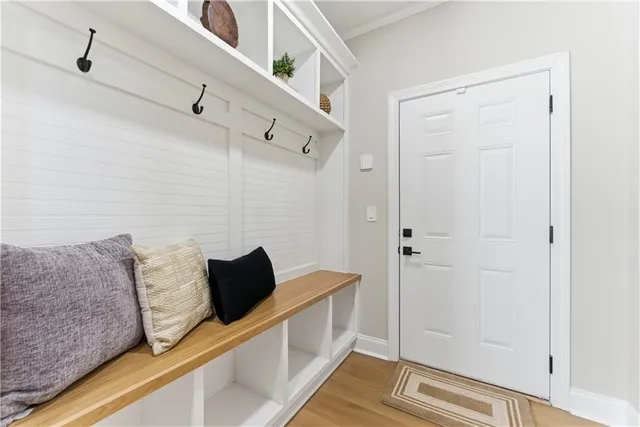 a view of bedroom with furniture and wooden floor