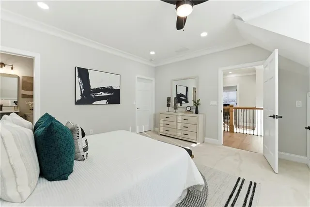 a bedroom with a large bed and a dresser