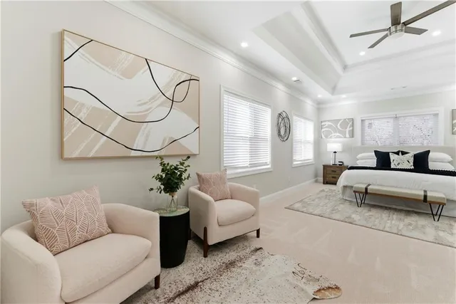 a living room with furniture or couch and a potted plant