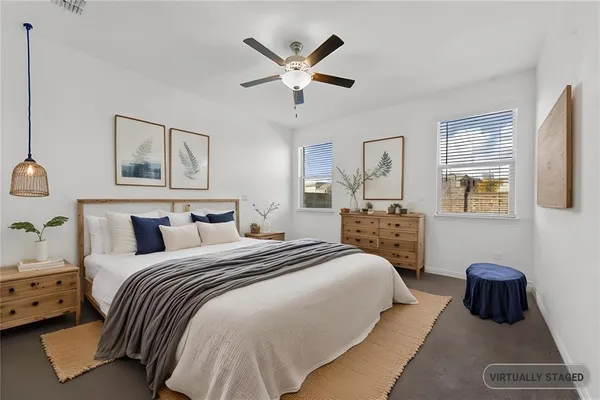 a bedroom with bed and window