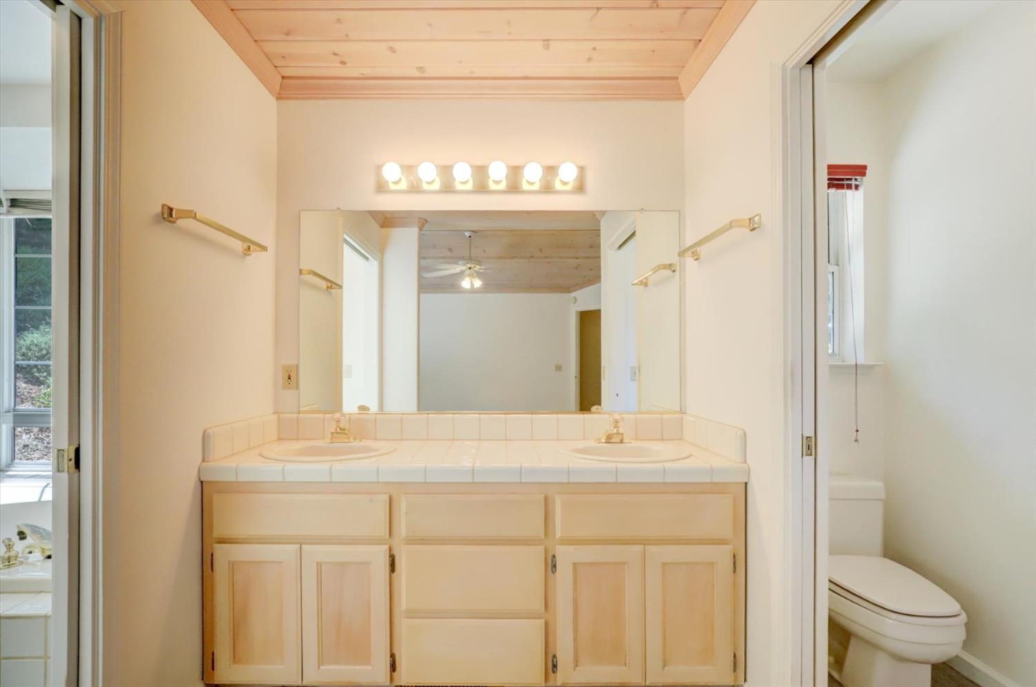 16479 Brewer Road Grass Valley, CA 95949 - Photo 20 of 33 a bathroom with a sink and a mirror