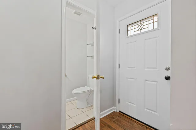 a view of a bathroom with wooden floor