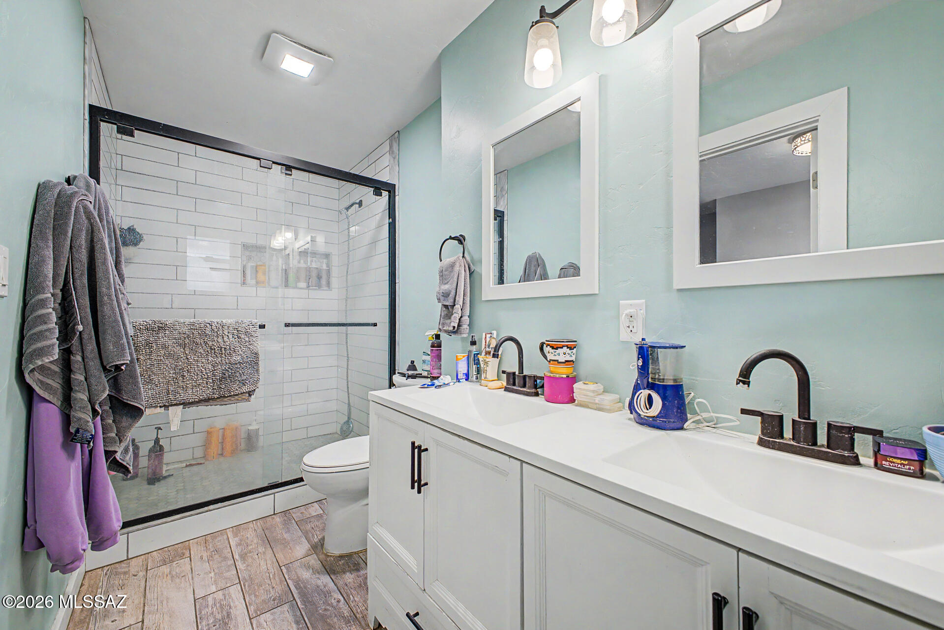 1172 East Allen Road Tucson, AZ 85719 - Photo 14 of 25 a bathroom with a sink vanity mirror and toilet