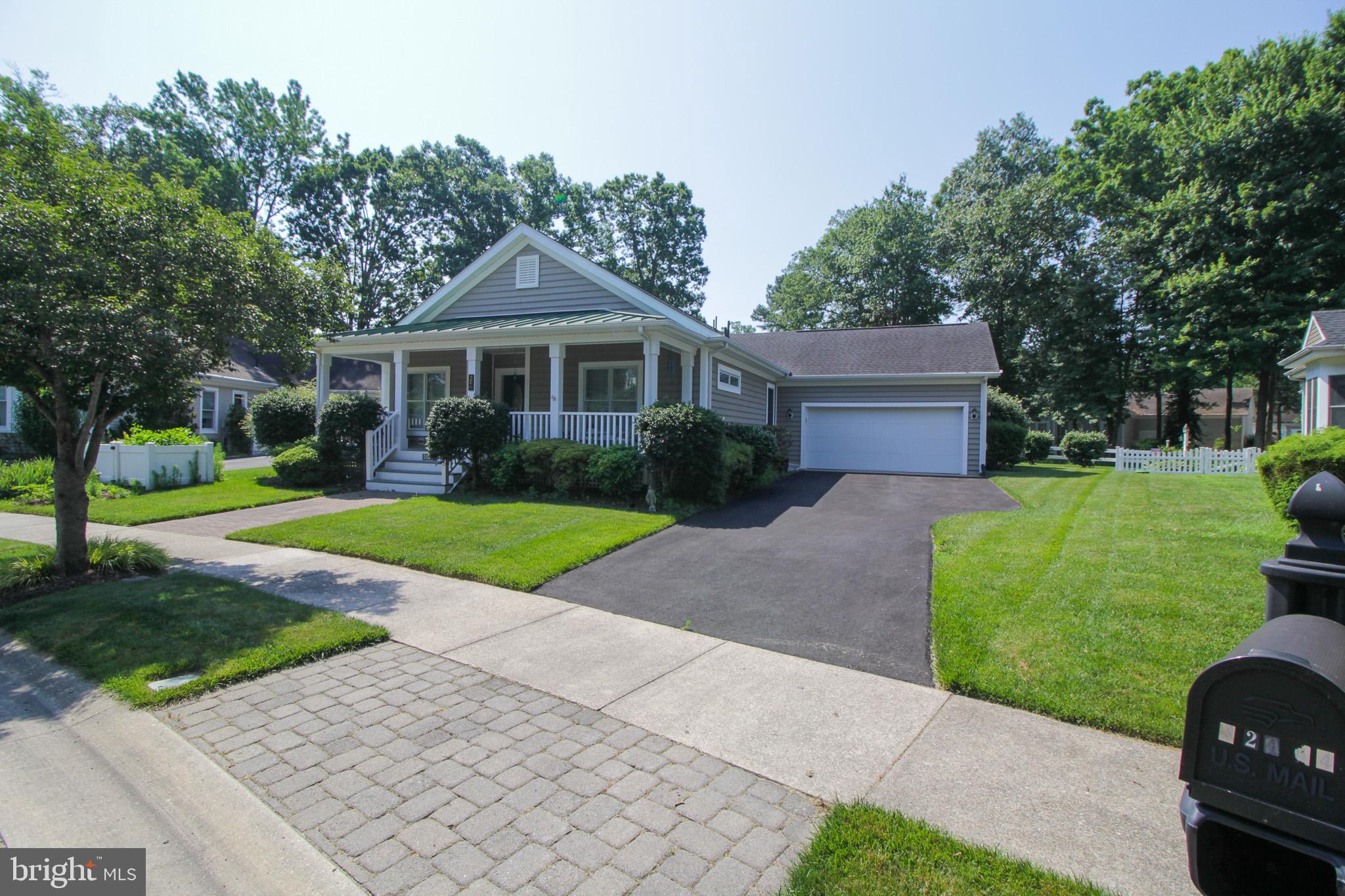 32464 Approach Way, Unit 3278 Millsboro, DE 19966 - Photo 1 of 47 a front view of a house with a yard