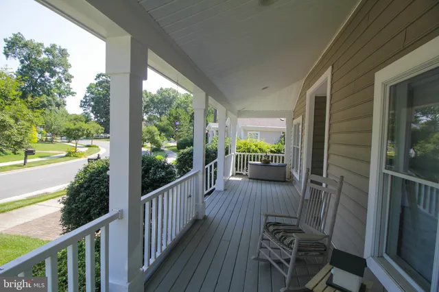 a view of a porch with wooden floor and outdoor space