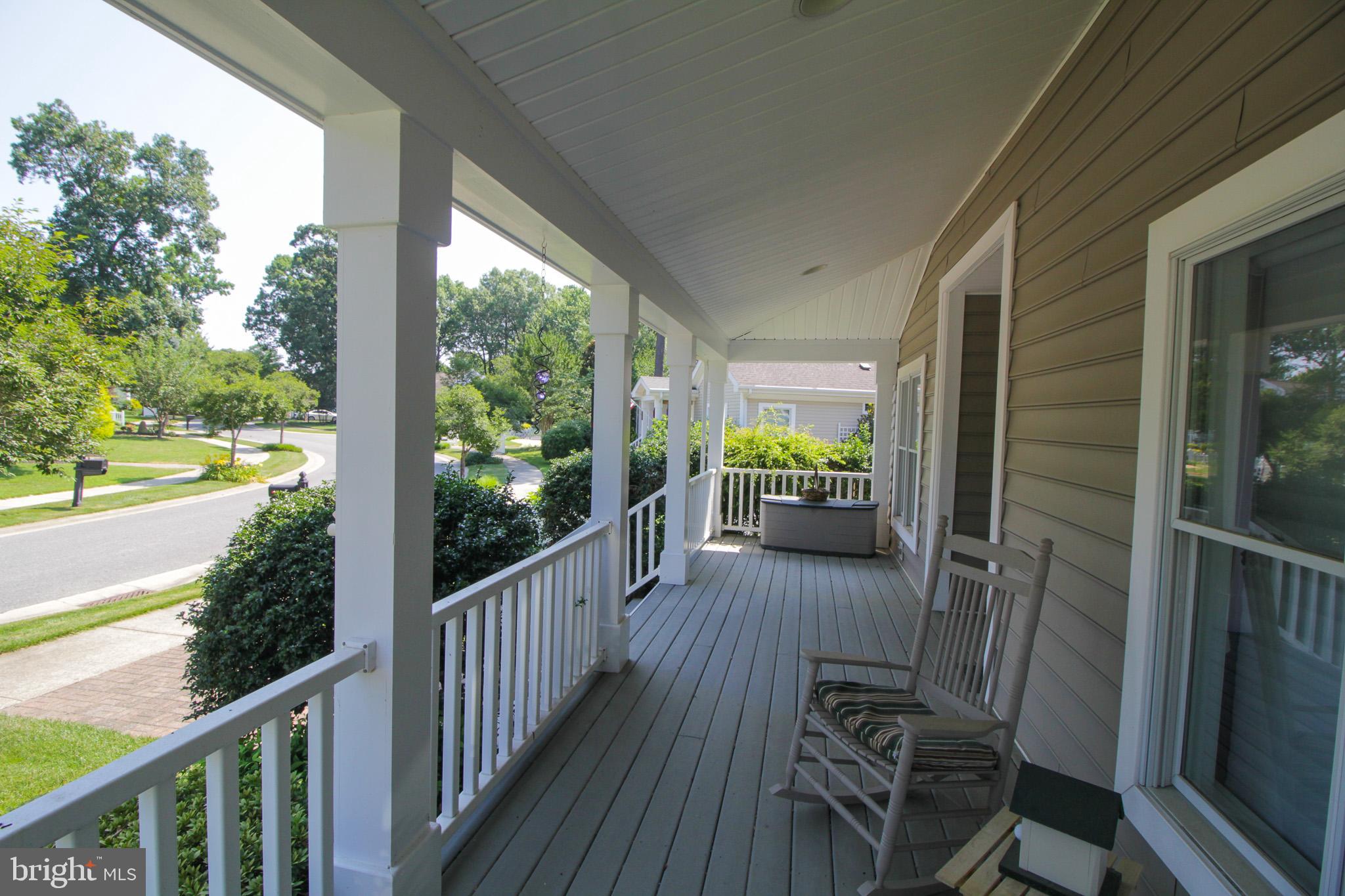 32464 Approach Way, Unit 3278 Millsboro, DE 19966 - Photo 11 of 47 a view of a porch with wooden floor and outdoor space