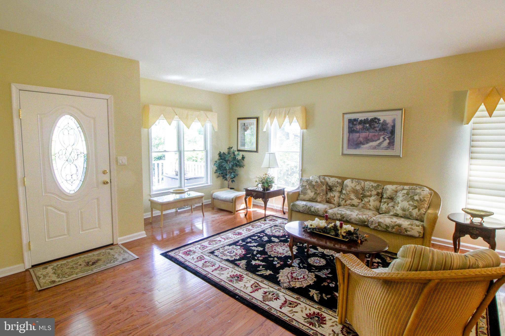 32464 Approach Way, Unit 3278 Millsboro, DE 19966 - Photo 17 of 47 a living room with furniture and a window