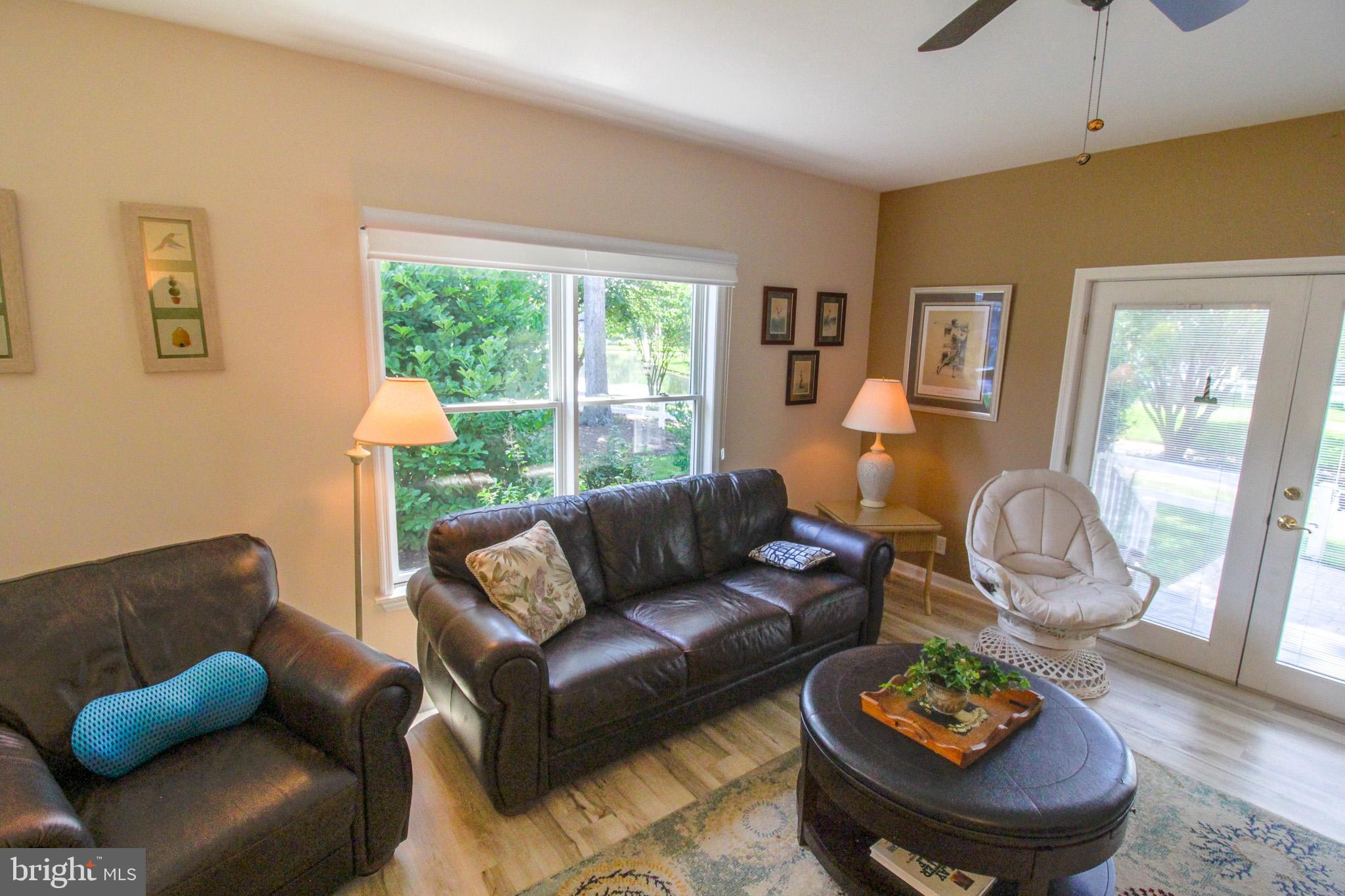32464 Approach Way, Unit 3278 Millsboro, DE 19966 - Photo 26 of 47 a living room with furniture and a large window