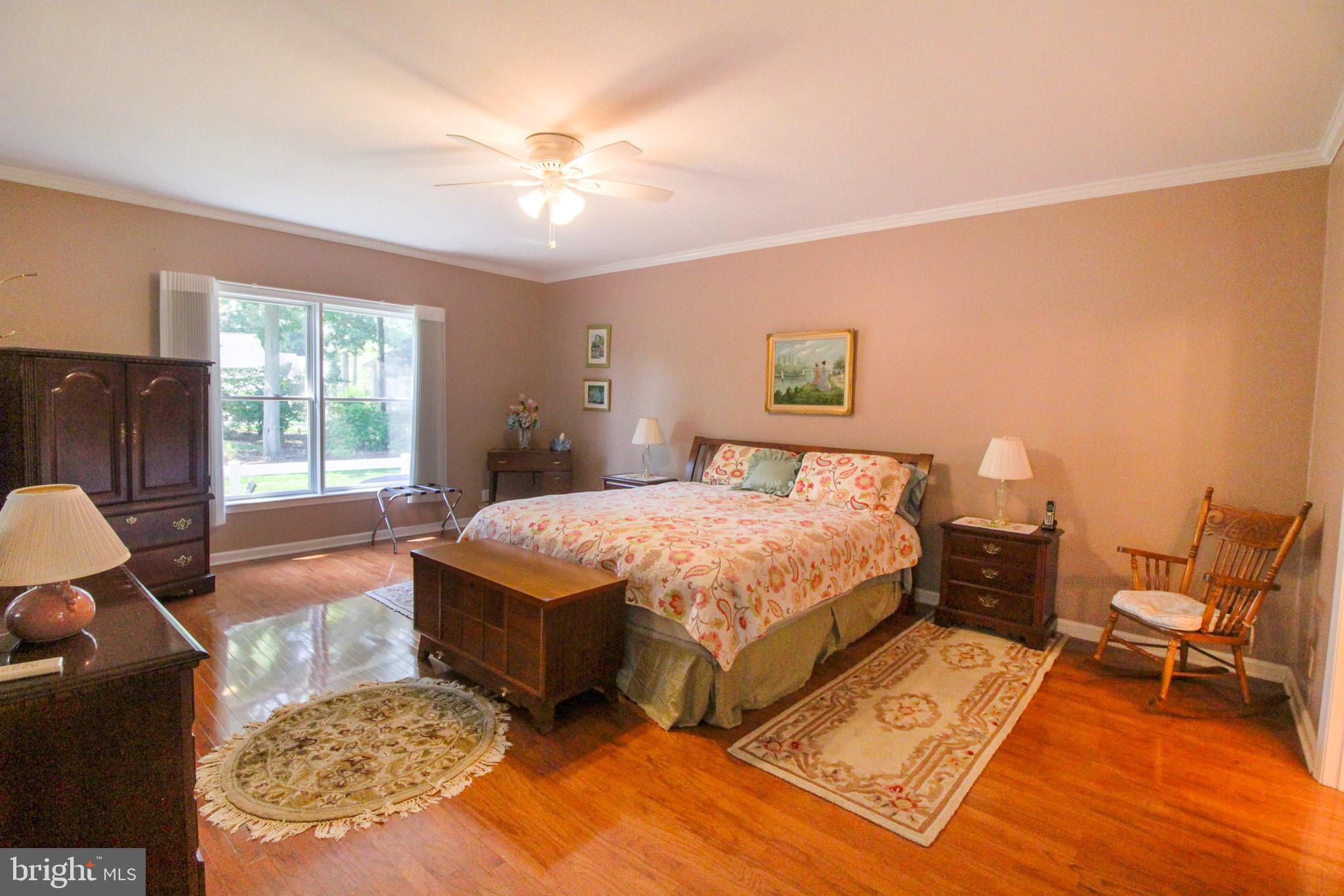 32464 Approach Way, Unit 3278 Millsboro, DE 19966 - Photo 28 of 47 a spacious bedroom with a bed and window