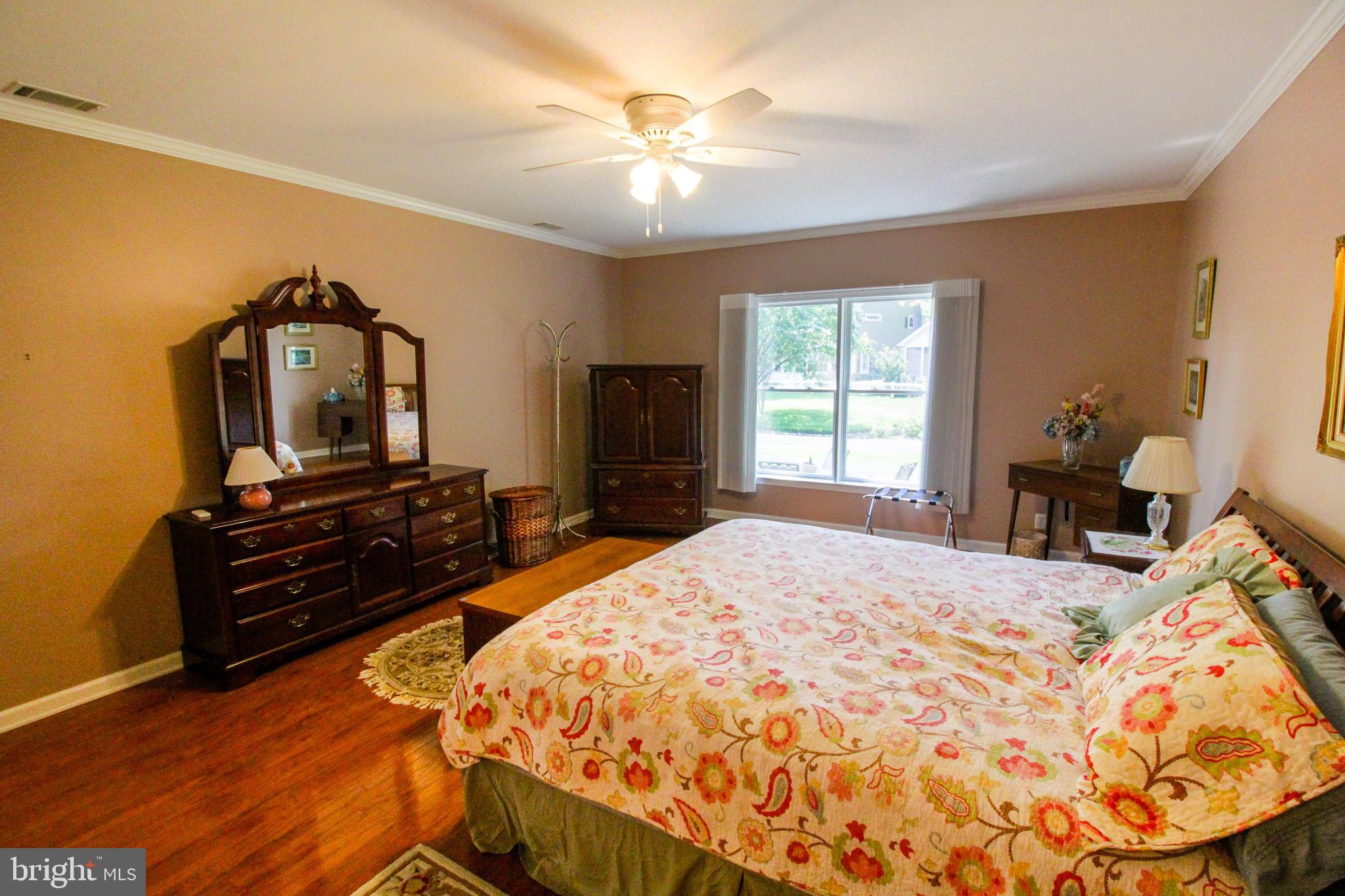 32464 Approach Way, Unit 3278 Millsboro, DE 19966 - Photo 29 of 47 a bedroom with a bed and a television