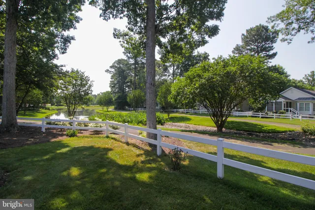 a view of swimming pool with sitting area and garden