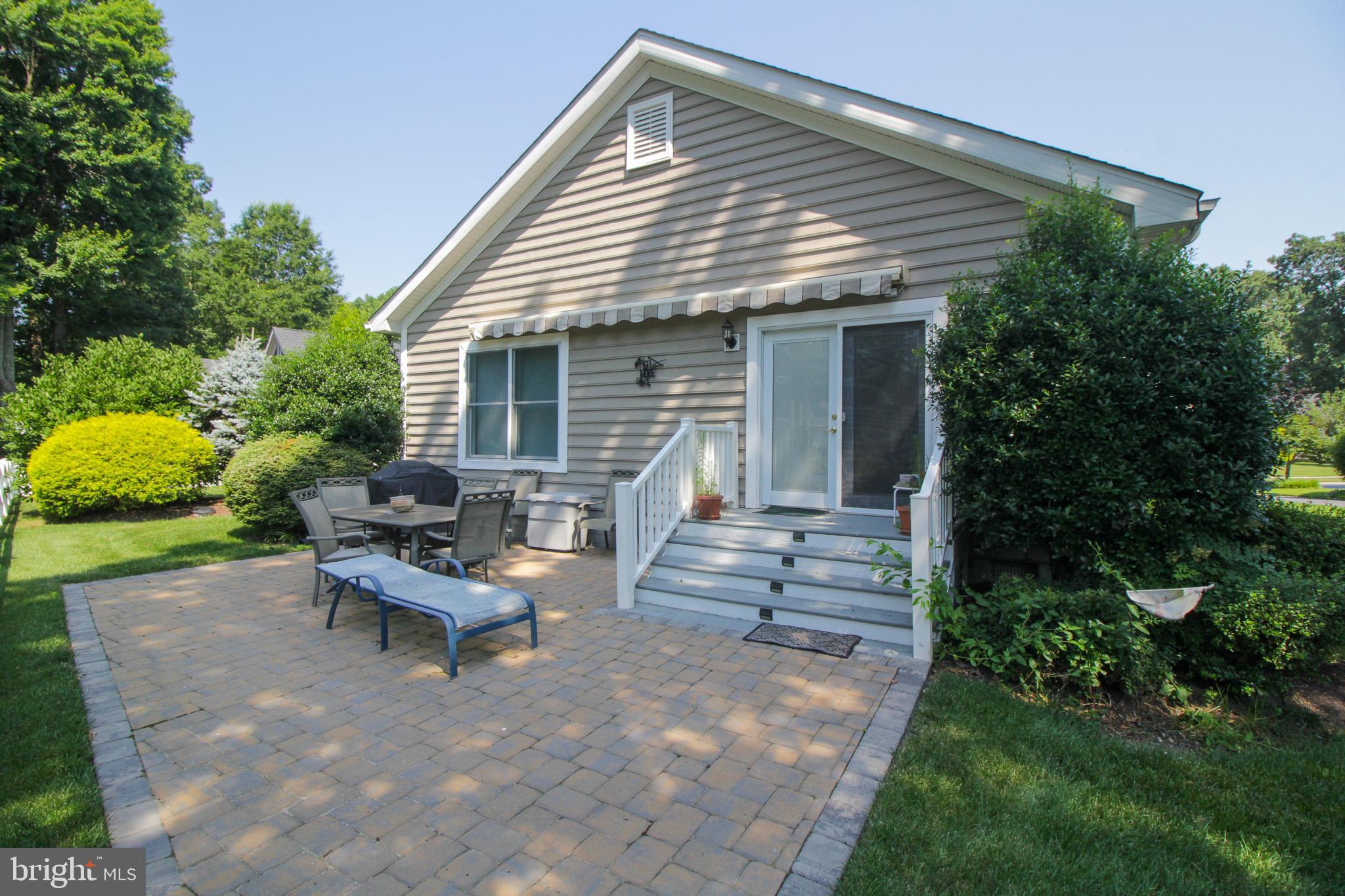 32464 Approach Way, Unit 3278 Millsboro, DE 19966 - Photo 8 of 47 a view of a house with backyard and sitting area
