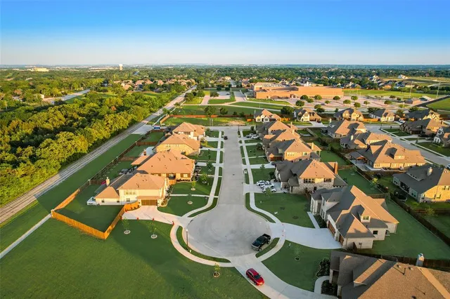 an aerial view of a house with a ocean view