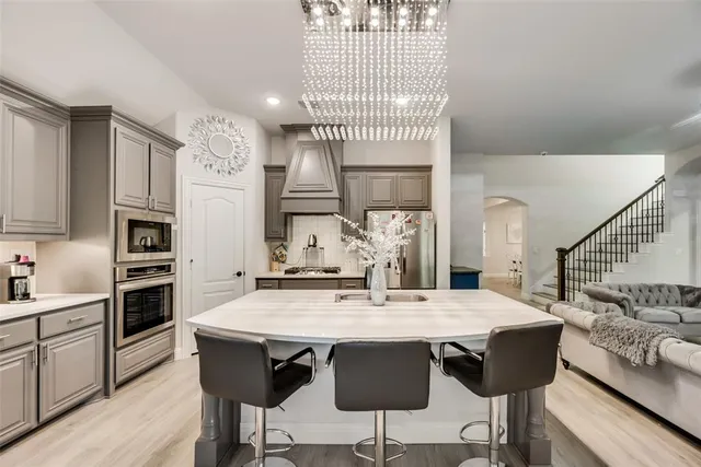 a view of kitchen with cabinets and wooden floor