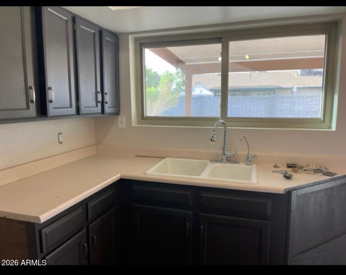 4008 West Laurel Lane Phoenix, AZ 85029 - Photo 3 of 10 a kitchen with a sink and a window