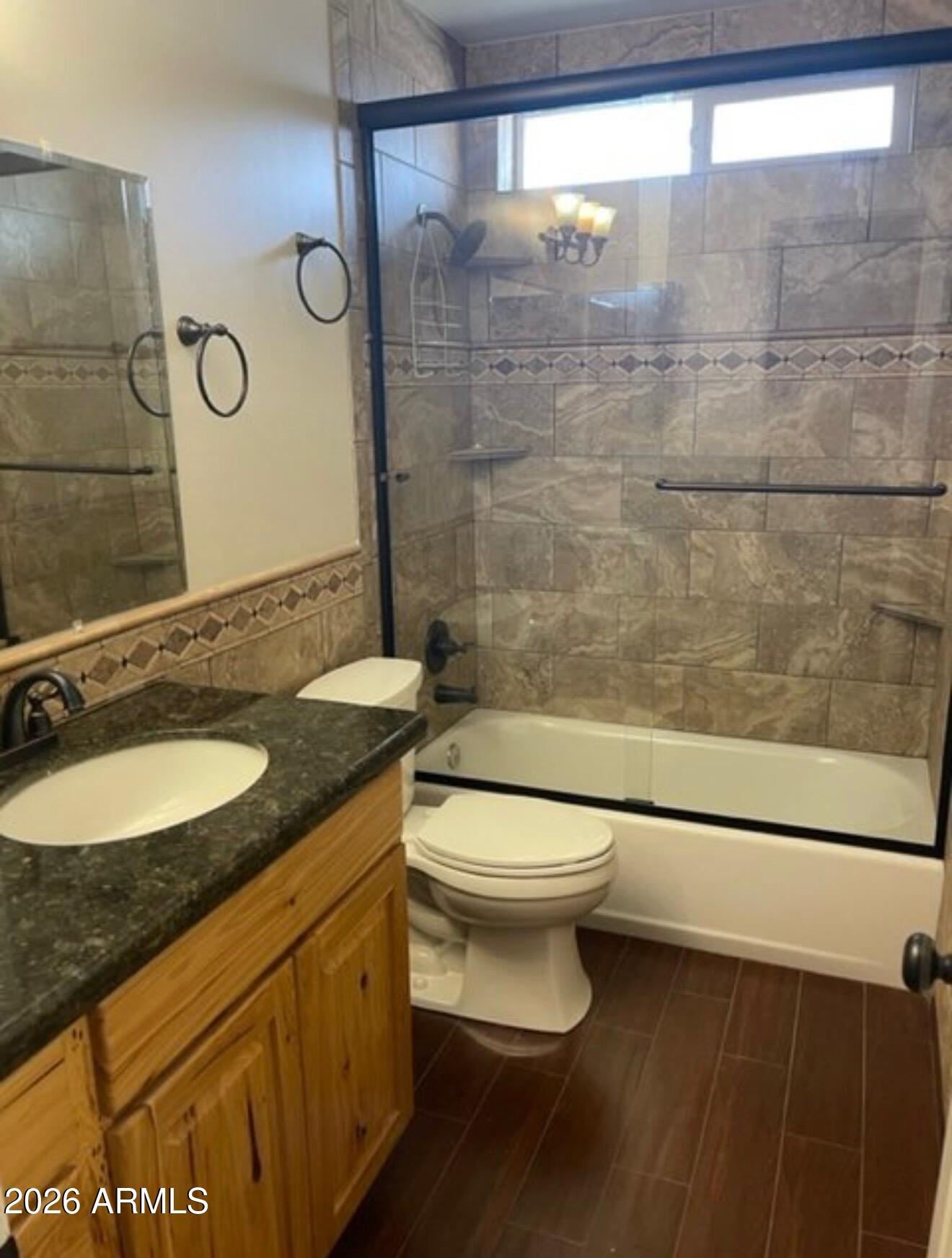 4008 West Laurel Lane Phoenix, AZ 85029 - Photo 8 of 10 a bathroom with a granite countertop sink toilet and shower
