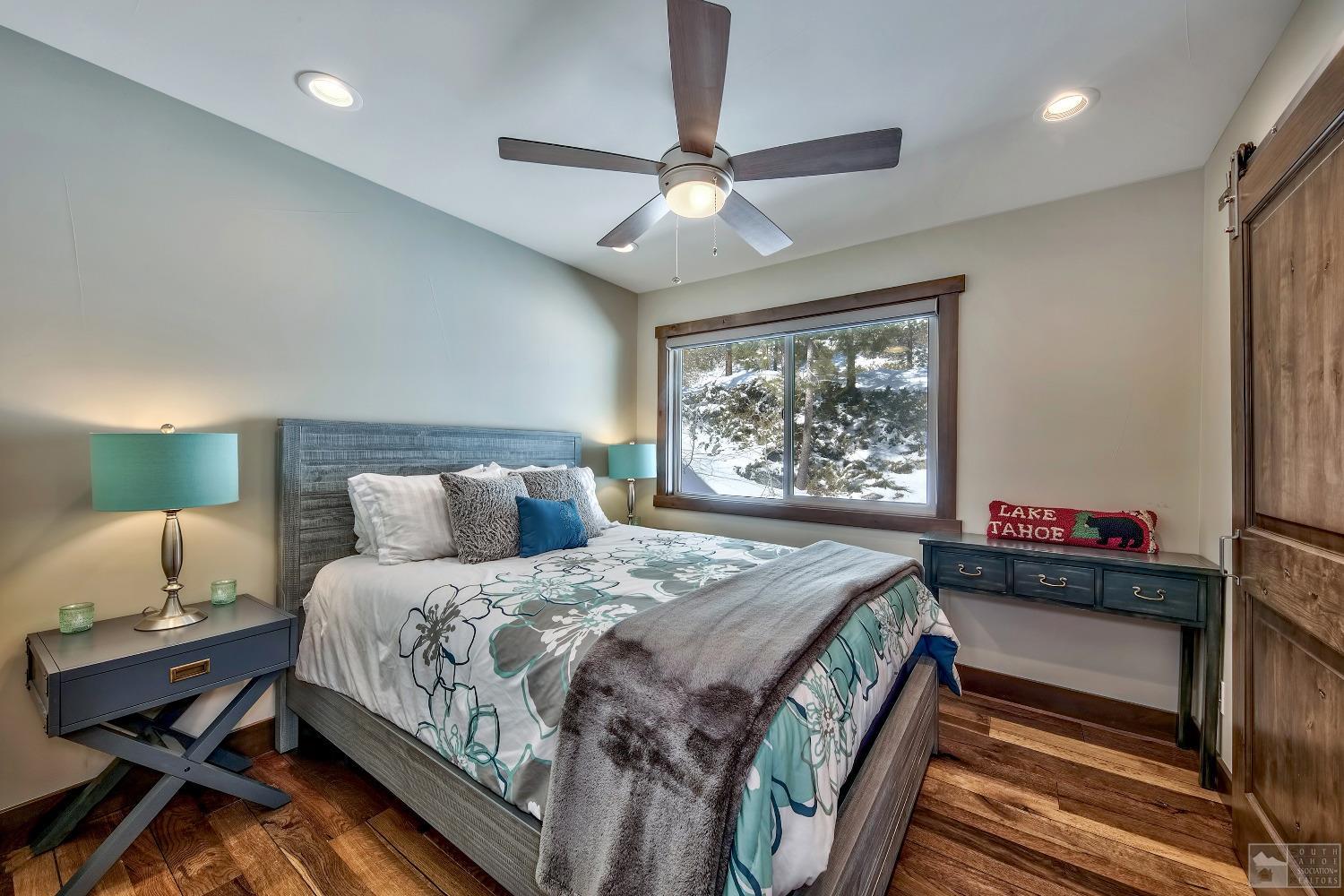 416 Maryanne Drive Stateline, NV 89449 - Photo 11 of 32 a bedroom with a bed and a window
