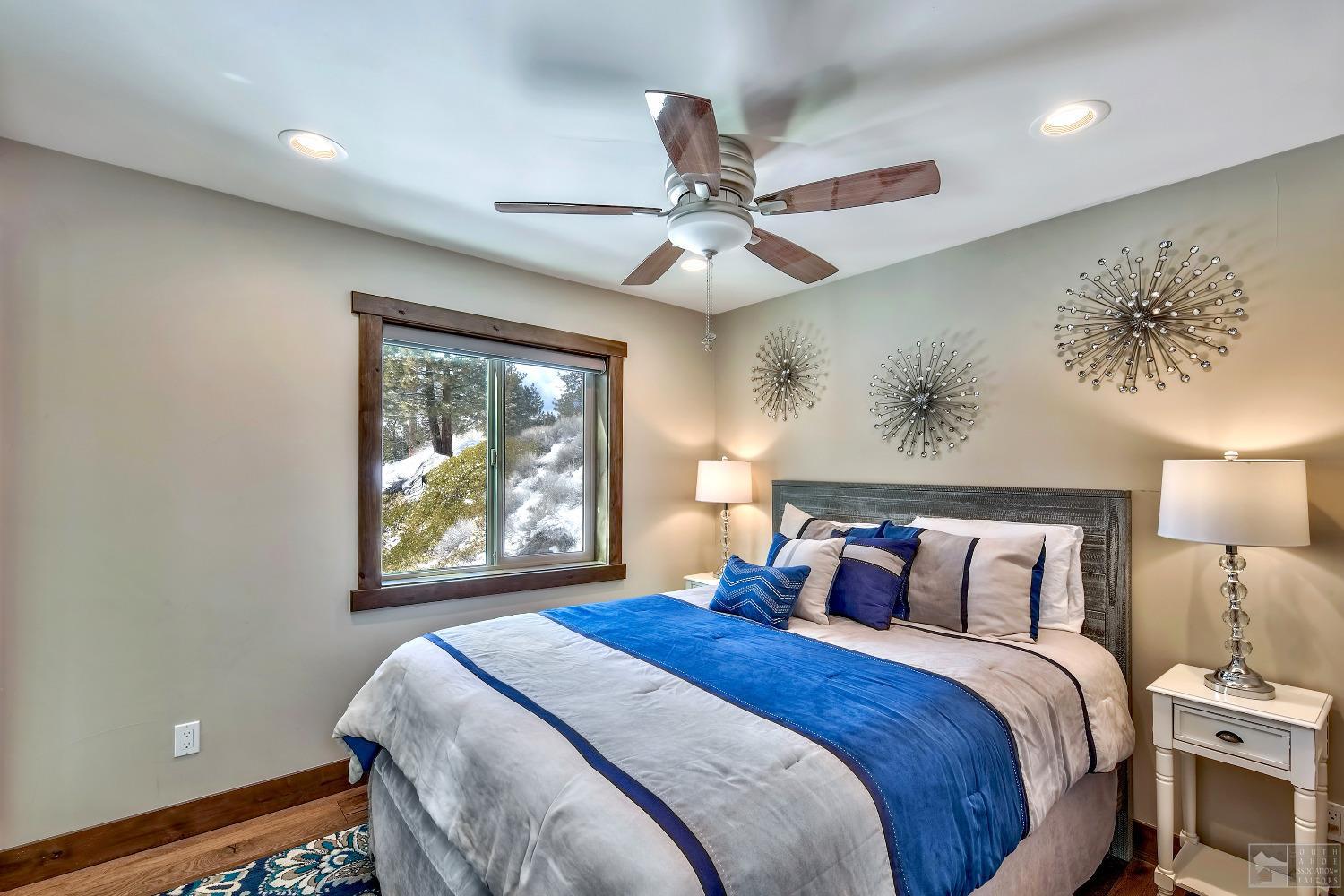 416 Maryanne Drive Stateline, NV 89449 - Photo 22 of 32 a bedroom with a large bed and a window