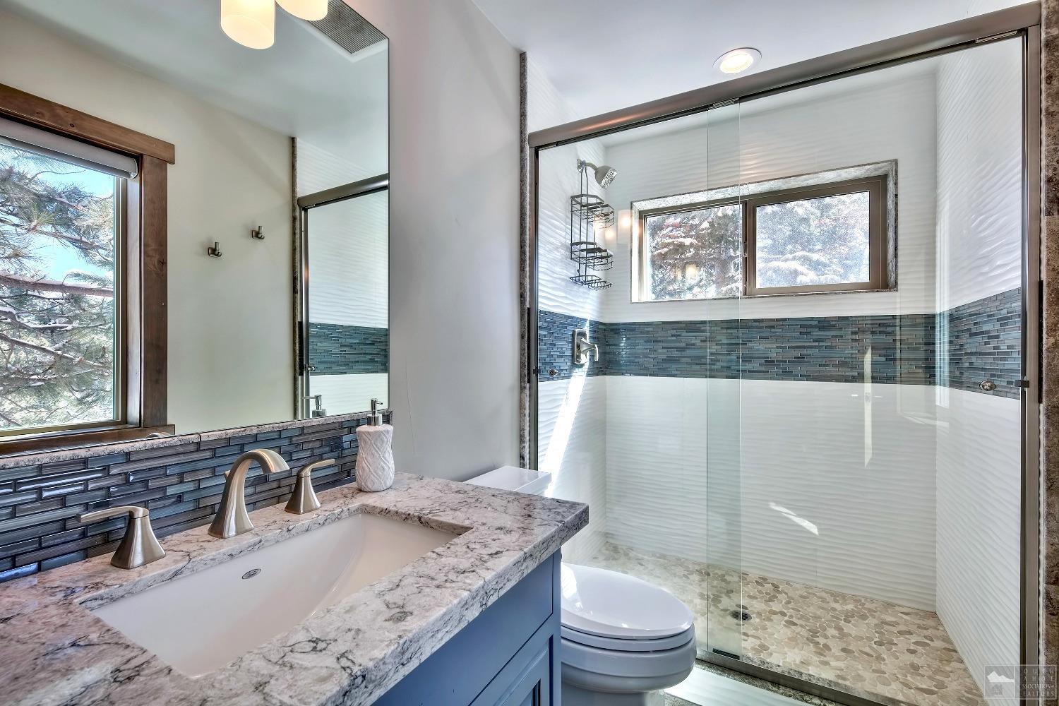 416 Maryanne Drive Stateline, NV 89449 - Photo 23 of 32 a bathroom with a granite countertop sink toilet and shower