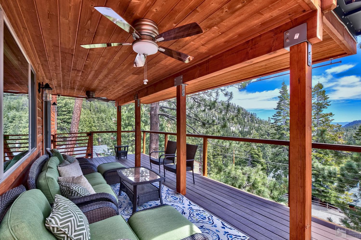 416 Maryanne Drive Stateline, NV 89449 - Photo 29 of 32 a living room with furniture a ceiling fan and a large window