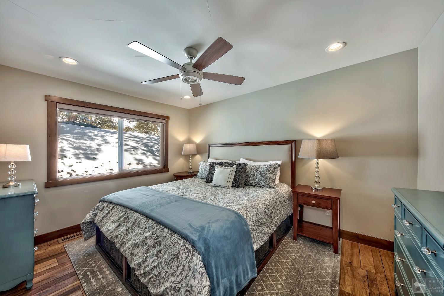 416 Maryanne Drive Stateline, NV 89449 - Photo 8 of 32 a bedroom with a large bed and a window