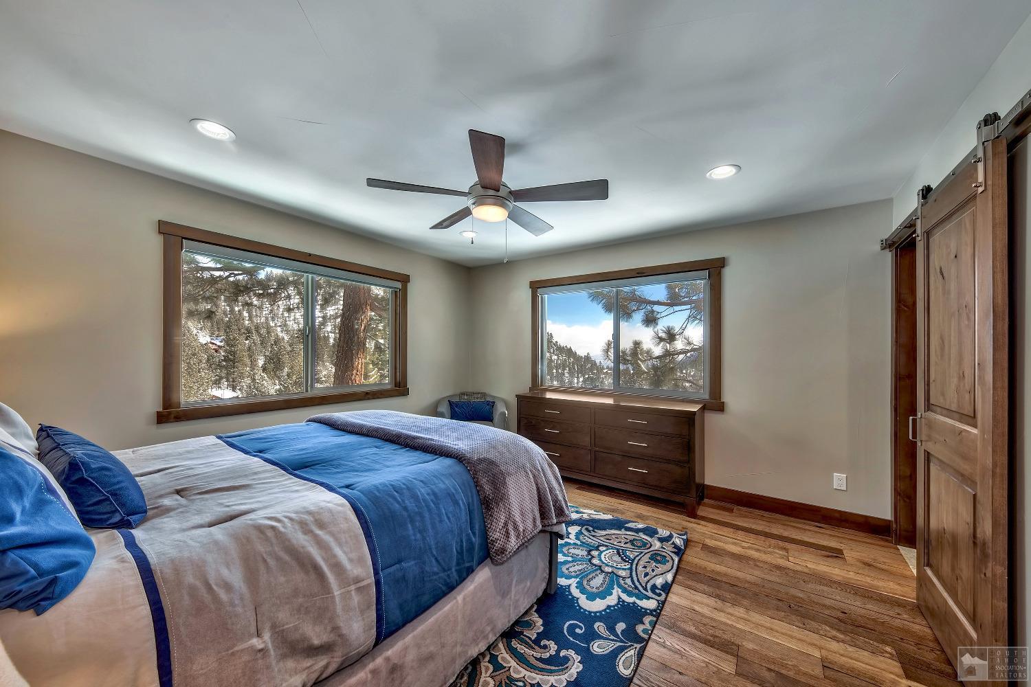 416 Maryanne Drive Stateline, NV 89449 - Photo 9 of 32 a bedroom with a large bed and a window