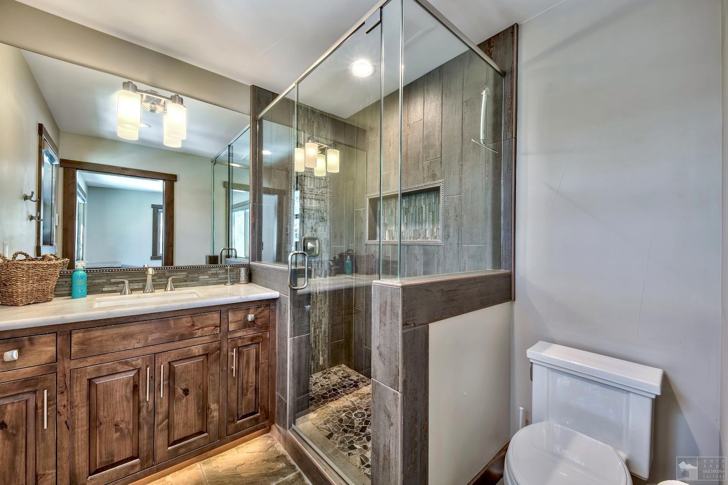 416 Maryanne Drive Stateline, NV 89449 - Photo 10 of 32 a bathroom with a sink a toilet and mirror