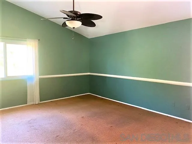 13940 Carriage Road Poway, CA 92064 - Photo 13 of 27 a view of an empty room with a window