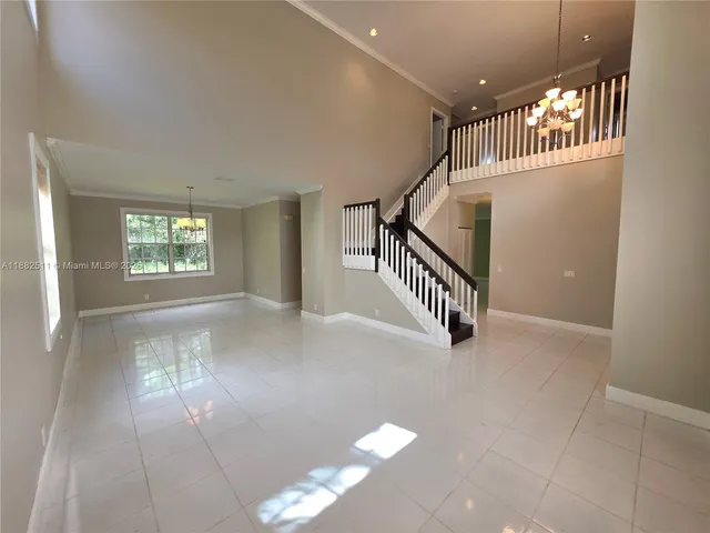 a view of a house with backyard porch and garden