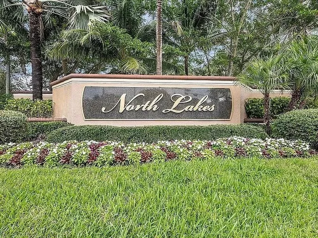 a view of a lake with houses in the back