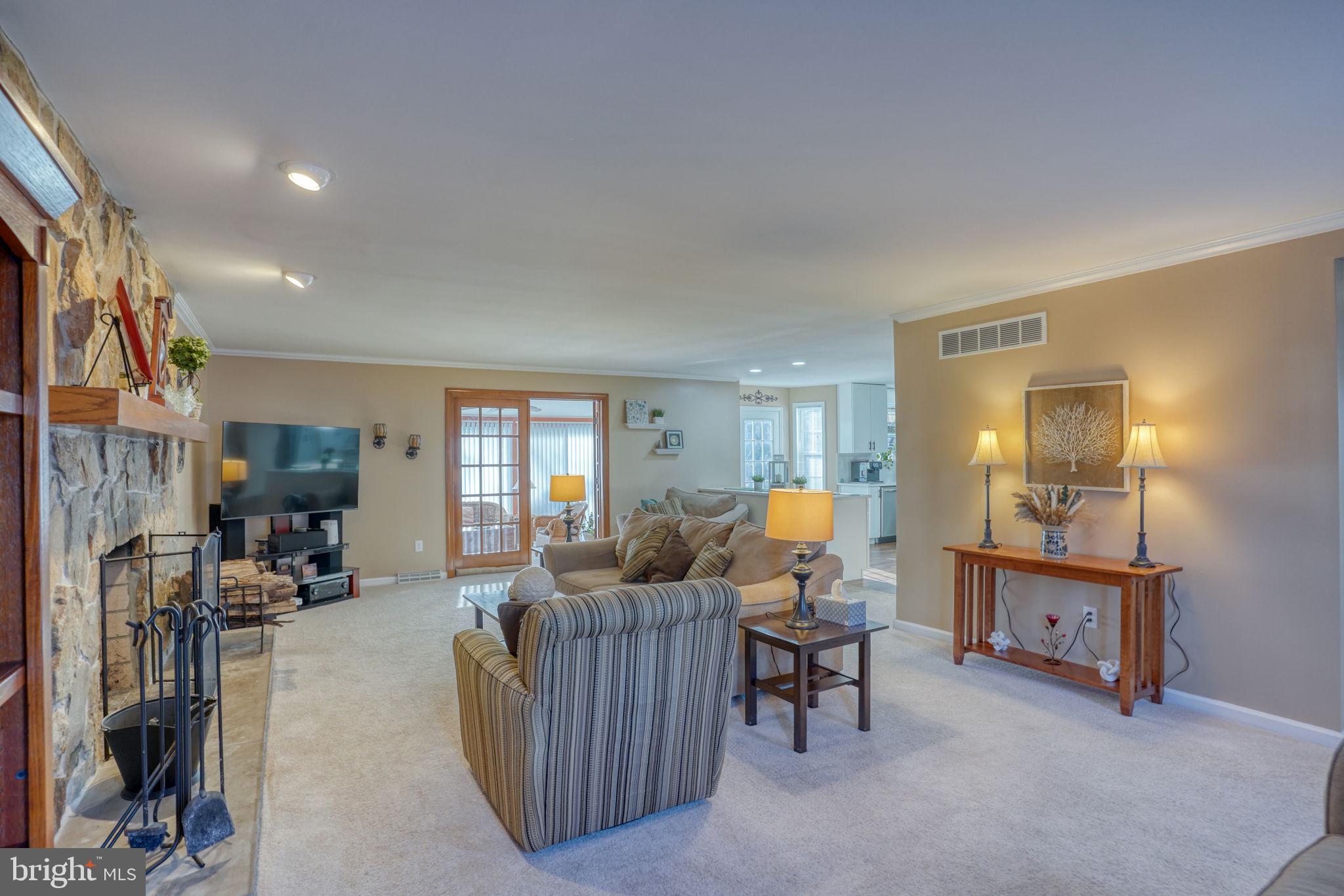 108 Burning Tree Road Dover, DE 19904 - Photo 21 of 70 a living room with furniture and a large window