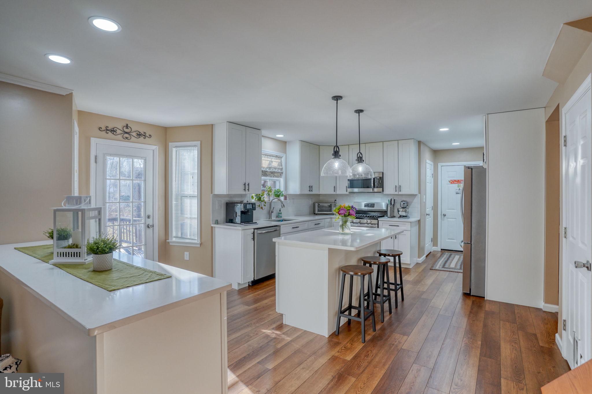 108 Burning Tree Road Dover, DE 19904 - Photo 31 of 70 a kitchen with a table and chairs